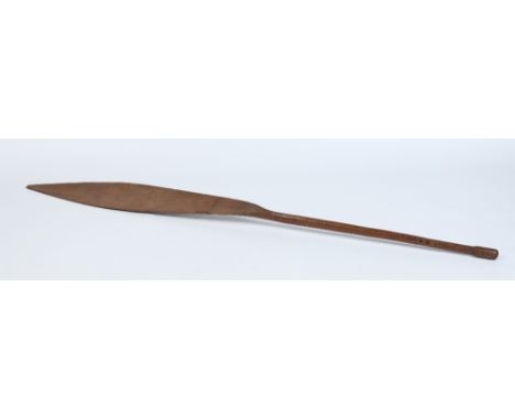 A Pacific Islands carved hardwood paddle club. With angled elongated bowl having a simple triangle carved terminal and with a