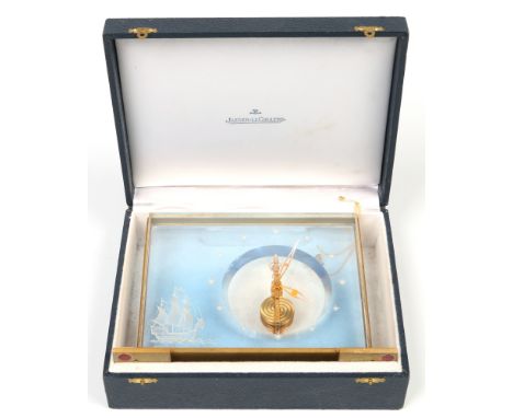 A Jaeger Le Coultre Marina brass and perspex mantel clock in original fitted case. With offset floating movement and having e