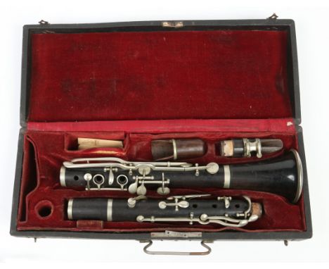 A cased clarinet stamped Jerome Thibouville Lamy London.