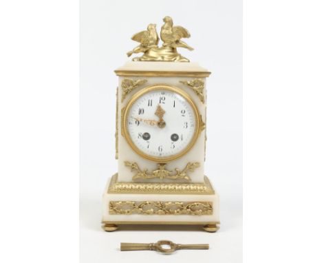 A 19th century French alabaster mantel clock with gilt metal mounts. With enamel dial having Arabic numeral markers and minut