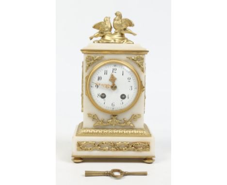 A 19th century French alabaster mantel clock with gilt metal mounts. With enamel dial having Arabic numeral markers and minut