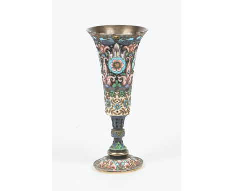 A champleve enamel pedestal goblet, possibly Russian, 13cm. Condition Report. To be used as a guide only. Foot slightly missh