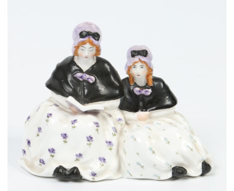 A Royal Worcester figure group by Frederick Gertner of two seated young ladies reading. Printed green mark, model 2616, date 