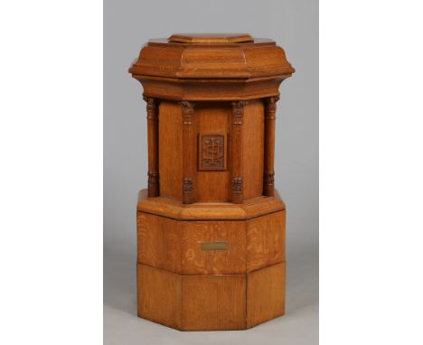 A Puginistic light oak octagonal church font. Plaque reads; Baptismal Font restored, to the glory of God, and in loving memor