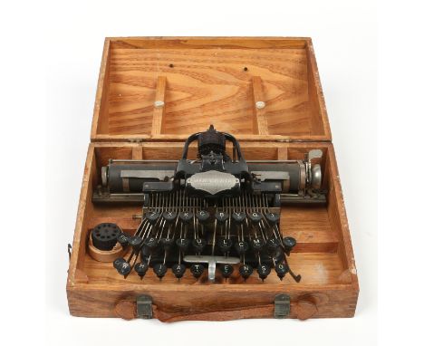 An antique oak cased typewriter "Blickensderfer", Newcastle on Tyne, Made in USA.  Condition Report. To be used as a guide on