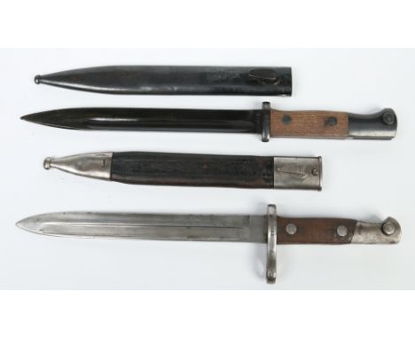 A Spanish 1893 model bayonet in metal mounted leather scabbard and a Spanish 1943 model bayonet in metal scabbard.  Condition