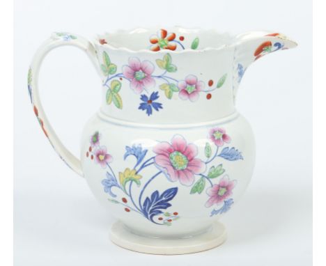A Don pottery jug with lobed rim and moulded loop handle. Printed and enamelled with flower sprays and a butterfly. Printed G