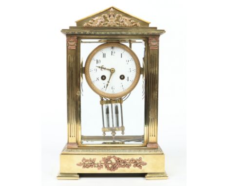 A 19th century French brass cased four glass mantel clock of architectural form. With reeded pilasters and supported on brack
