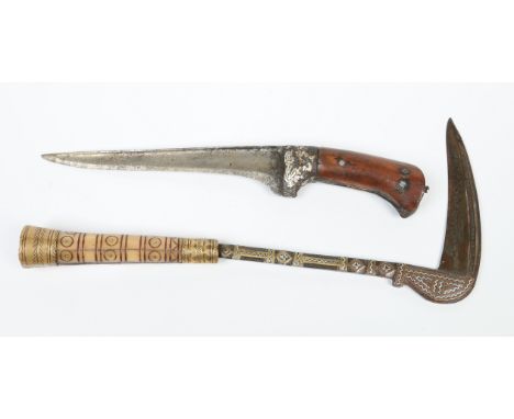 A 19th century Indo Persian Pesh Kabz dagger with gold and silver inlay along with an Afghan fighting axe with carved horn ha