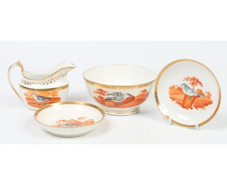 An early 19th century Ridgeway part teaset decorated with named ornithological subjects in orange and black enamels under gil