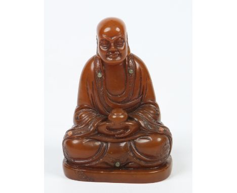 A 19th century Chinese carved shoushan figure of a seated meditating Buddha. Inlaid with coral and jade jewels and delicately