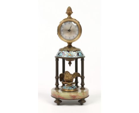 A French lacquered brass and onyx mantel clock ornamented with a bird and housing a single train cylinder 30 hour spring driv