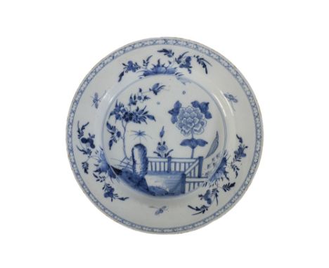 18TH CENTURY DELFTWARE CHARGER in blue and white, with a central chinoiserie scene, within a cross hatch border