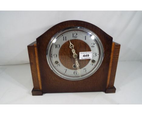 An oak cased Westminster chiming mantel clock by Enfield, with key and pendulum - Estimate £20 to £30  This lot MUST be paid 