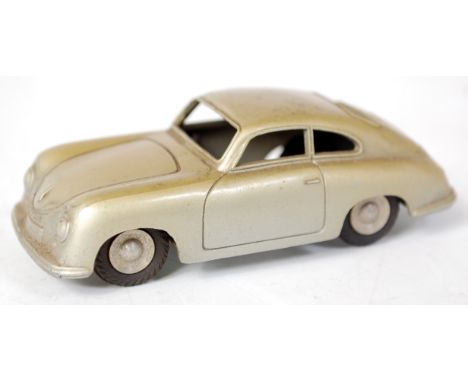 Marklin, Germany, No. 8004, Porsche 356, two tone gold and silver body, silver trim with silver baseplate, aluminium spun hub