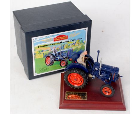 Britains, 8715 Fordson E27N Major tractor, dark blue body with orange wheels, Henry Ford figure with cap fixed to seat, in th