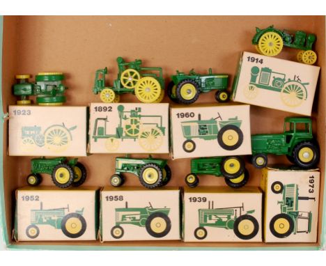 ERTL for John Deere small scale diecast tractor group, 8 boxed examples to include; No.519 and No.561-567, all boxed, some we