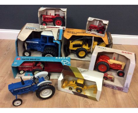 An Ertl Ford 9700 Tractor model, a John Deere Skidder and six further Ertl tractors (8)Condition report: All as found
