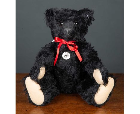 A Steiff modern 1912 replica teddy bear numbered 29/1912, 48cm high complete with original packagingCondition report: At pres