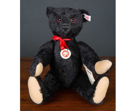 A Steiff Titanic commemorative teddy bear numbered 14/1912, 35cm long complete with original packaging and documentationCondi