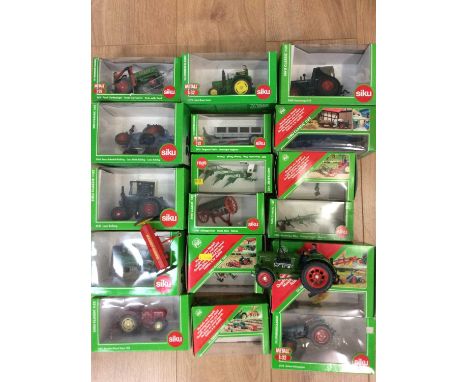 Nineteen Siku scale models of vintage tractors and implements, seventeen with their boxes, two withoutCondition report: As fo