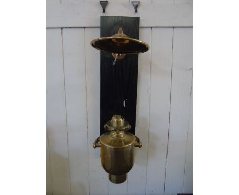 Wall mounted ships gimble oil light with heat shield
