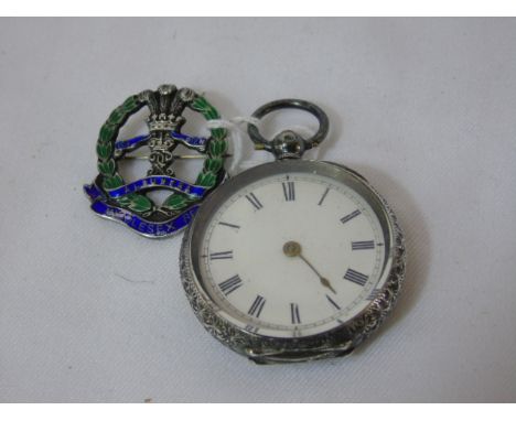 HM Silver fob watch and a silver Middlesex Regt badge