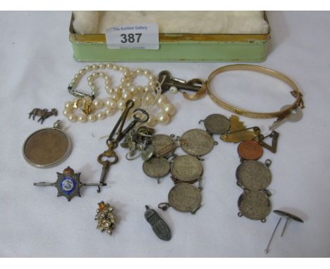 Vintage tin of badges, buttons, coins etc