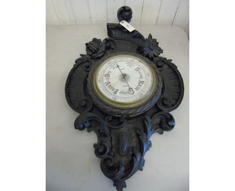 Heavy carved oak barometer