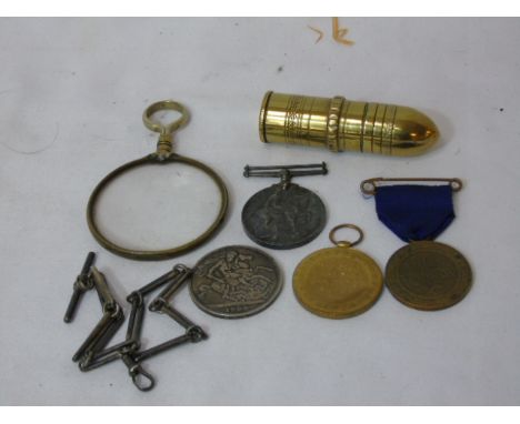 Qty of medals, vintage magnifying glass, watch chain and brass lighter in the form of a bullet