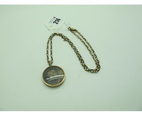 An Edwardian 9ct Gold Circular Locket Pendant, within seed pearl border, on a 9ct gold belcher link chain, length 46cm. 