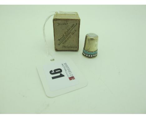 David Andersen; A Decorative Thimble, highlighted in turquoise and white enamel, stamped makers mark and "925 S", in original