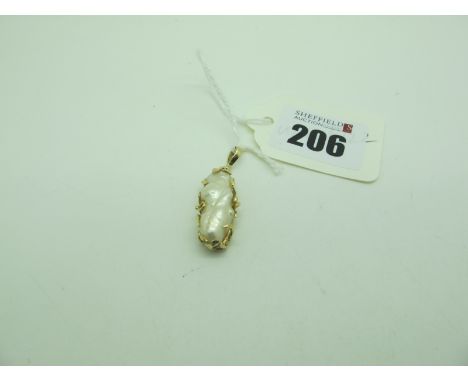 A Modern Baroque Pearl Pendant, within openwork setting, stamped "14k". 