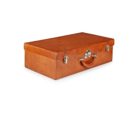 HERMÈS LEATHER SUITCASE CIRCA 1925 of plain rectangular form covered in tan pigskin, chrome hardware, stamped with a black mo