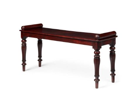 WILLIAM IV MAHOGANY HALL BENCH, IN THE MANNER OF GILLOWS EARLY 19TH CENTURY the long plank seat with cylinder bolster ends, r