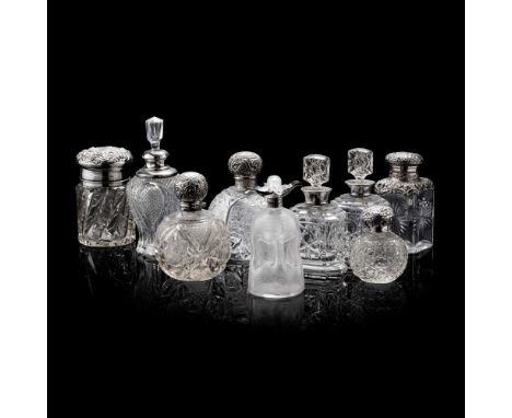 COLLECTION OF SILVER MOUNTED CUT GLASS SCENT BOTTLES AND JARS 19TH CENTURY including a pair of flattened octagonal bottles cu