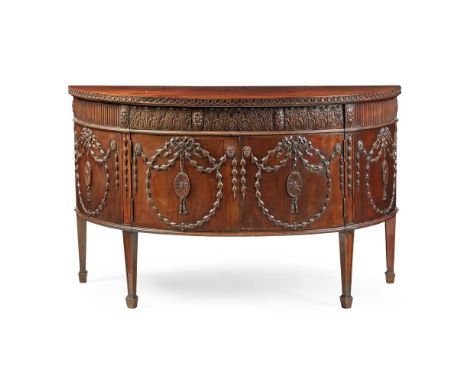 GEORGE III MAHOGANY DEMILUNE COMMODE, IN THE MANNER OF ROBERT ADAM MID 18TH CENTURY the demi-lune top with a key moulded edge