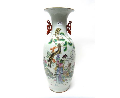 A tall Chinese famille-rose two-handled baluster vase, 20th century, painted with a young woman beaneath a pine tree flanked 