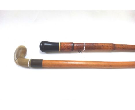 An early 20th walking stick with carved horn handle and brass collar (91cm) and a bamboo walking stick with ebonised pommel. 