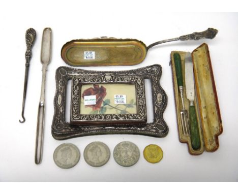 A silver christening knife and fork, having green stained handles, with a case, circa 1800, two silver mounted photograph fra