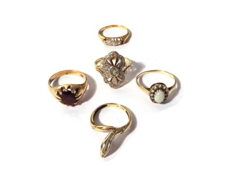 An 18ct gold ring, mounted with four cushion shaped diamonds (the fifth diamond lacking), a gold and garnet set single stone 