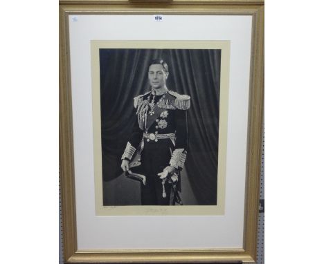 Peter North (20th century), Portrait of George VI, photograph, signed by artist and by the King and dated 1937, 66cm x 49cm. 