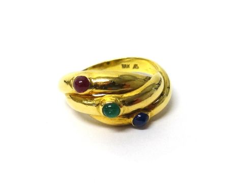 A gold, cabochon ruby, cabochon emerald and cabochon sapphire set three stone ring, in a three row design, detailed 18 K, rin