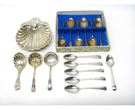 Silver, comprising; a King's pattern caddy spoon, with a scallop shell shaped bowl, London 1900, two sugar sifting spoons, a 