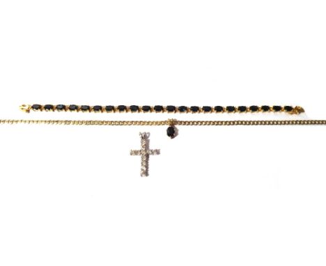 A gold and sapphire set bracelet, claw set with a row of oval cut sapphires, on a snap clasp detailed 585 14 K, a gold pendan