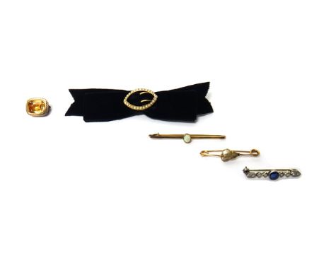 A diamond and sapphire set bar brooch, a gold and seed pearl set oval brooch, fitted to a black velvet bow, a gold bar brooch