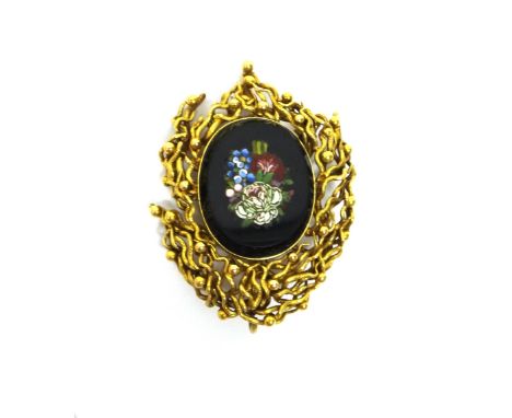 A gold mounted shaped oval mosaic pendant brooch, the mosaic designed as a bunch of flowers, the later mount in an abstract w