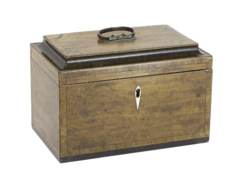 A George III mahogany and marquetry tea caddy with a silver plated handle, enclosing contrasting inlaid canisters with slidin
