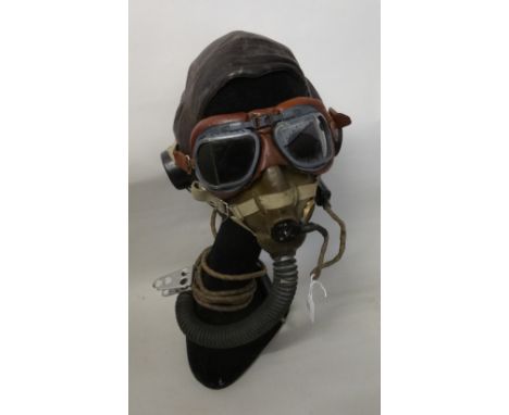 A C-type leather flying helmet, interior named D. W. Moore, with elasticated chin strap and Mk8 flying goggles, with tinted l