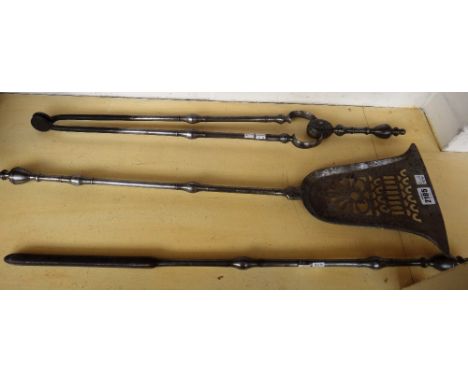 A set of Victorian steel fire tools with Adams style urn finials and knopped stems, the shovel (76cm) with pierced plate (3).